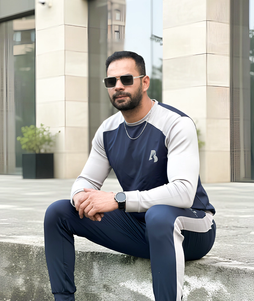 Man wearing Buckfits blue scuba tracksuit outdoors
